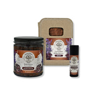 Set of lavender and elderberry themed products including a bath salts, soap, and lip balm on a white background.