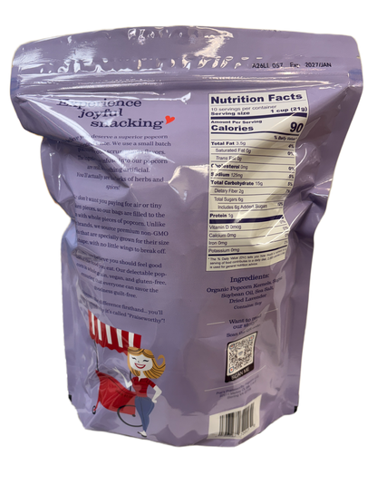 Back view of a purple package with text and nutrition facts label on a white background